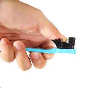 Dual-headed makeup brush with soft black bristles and blue handle for precise application.