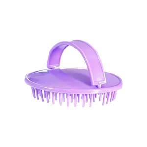 Purple silicone scalp massage brush with ergonomic handle for hair washing and cleaning.