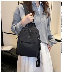 Stylish black nylon casual backpack for women, large capacity minimalist daily multi-pocket.