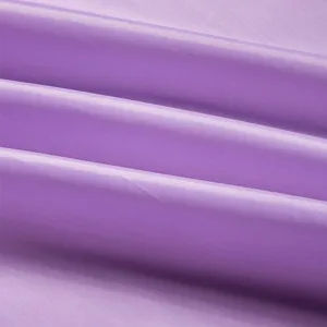 Tessuto per mantella da taglio tinta unita primo piano, materiale impermeabile liscio per salone.