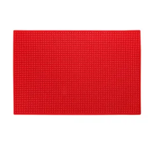 Alfombrilla antideslizante de silicona roja para herramientas de salón y organización.