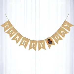Thanksgiving burlap banner with white turkey letters, rustic autumn party hanging decoration detail.