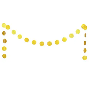 Close up of gold glitter paper circle garland, hanging dots for party decoration details.
