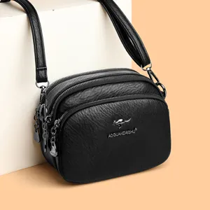 Black multi-layer leather crossbody bag with stylish chain zipper and spacious compartments.