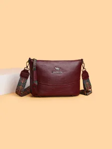 Elegante borsa a secchiello bordeaux da donna con tracolla etnica vista principale nuova