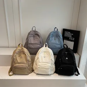 Casual nylon backpack for women, multi-pocket minimalist daypack for daily commute and travel.
