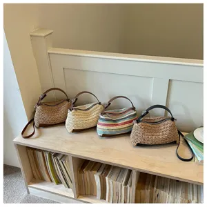 Woven straw crossbody bag for women, stylish lightweight summer beach shoulder handbag.