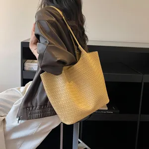 Large capacity woven leather tote bag for women, stylish shoulder handbag for daily commute.
