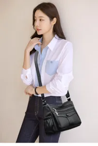 Borsa a tracolla elegante da donna in morbida pelle nera con tasche multiple e grande capienza.