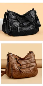 Close-up detail of the retro multi-zipper soft leather shoulder bag with fine stitching.