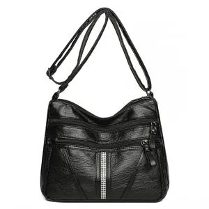 Black soft leather shoulder bag for women with multi-zipper compartments and rhinestone decor.