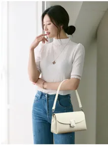 Chic women shoulder bag in elegant off-white with silver buckle, stylish daily accessory.