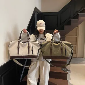 Grand sac de voyage en toile avec garniture en cuir PU, parfait pour les week-ends.