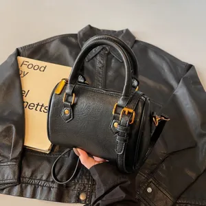 Black vintage Boston handbag for women, chic PU leather top handle crossbody bag main view.