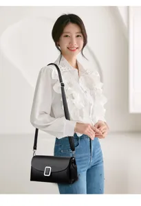 Retro minimalist women leather shoulder bag, elegant crossbody bag with metal clasp detail.
