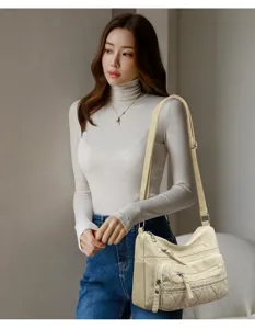 Beige multi-pocket shoulder bag for women, casual commuter messenger bag with stylish design.