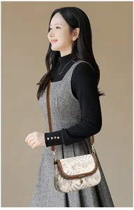 Vintage minimalist women's crossbody bag with retro pattern, brown leather trim, and chic shoulder strap.