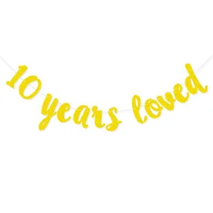 Close-up detail of the gold glitter 10 years loved banner string, perfect for celebration party.