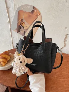 Stylish black leather tote bag with cute bear charm, casual handbag for women main view.