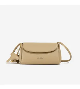Minimalist PU leather crossbody bag detail, elegant flap closure and cute elephant charm.