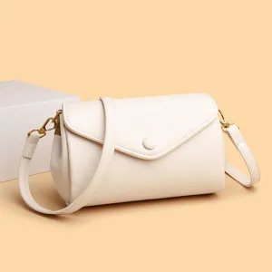 Retro minimalist women's shoulder crossbody bag in cream white with gold hardware, elegant.