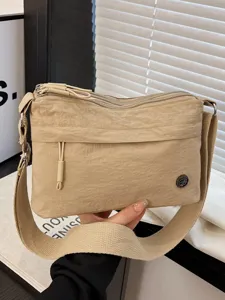 Casual nylon crossbody bag for women, multi-layer stylish shoulder bag, light and versatile.