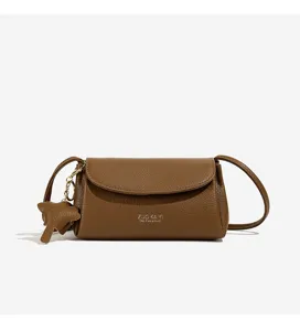 Brown leather crossbody bag for women, retro small casual shoulder bag with charm.