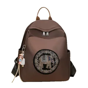 Casual travel backpack for women with stylish rhinestone elephant pattern and cute charm.