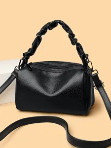 Black leather pillow bag for women, stylish scrunched handle crossbody handbag chic.