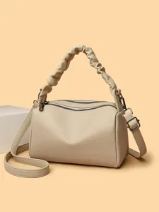 Retro beige leather pillow bag, stylish top handle and crossbody design for women daily use.