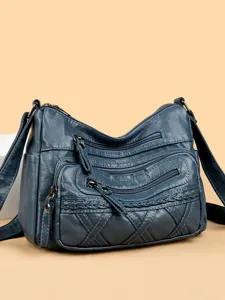 Stylish blue-grey women shoulder bag with multi-zipper pockets and woven texture.