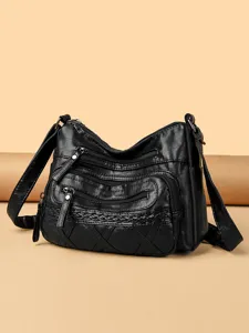 Women's black vintage PU leather shoulder crossbody bag with multi-zip pockets and chic design.