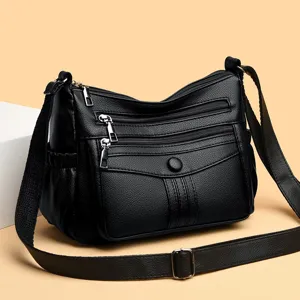 Borsa a tracolla nera in morbida pelle con tasche multiple per donna, elegante e comoda.
