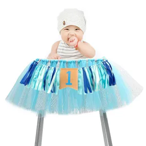 Detailed view of the blue tutu high chair banner with number one for baby first birthday party.