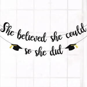 Black glitter graduation banner, she believed she could so she did party decor.