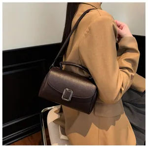Retro textured women shoulder bag, elegant brown PU leather small square handbag detail.