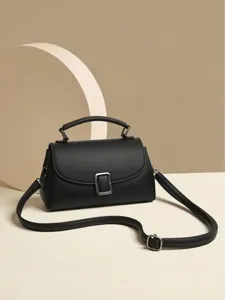 Retro black leather top-handle crossbody bag, elegant small square bag with metal buckle.