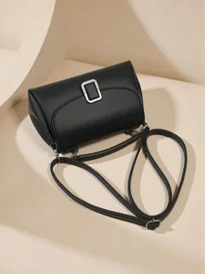 Retro textured women's shoulder bag, stylish light luxury black handbag with chic metal buckle.