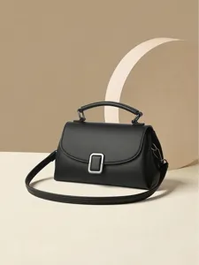 Classic black leather crossbody bag with silver buckle, elegant single shoulder handbag.