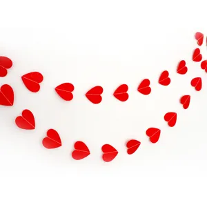 Red heart paper garland detail view, perfect for wedding engagement party and Valentine's day decor.