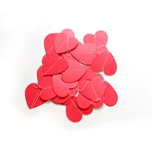 Detail shot of red heart paper garland string, perfect for Valentines day party decoration.