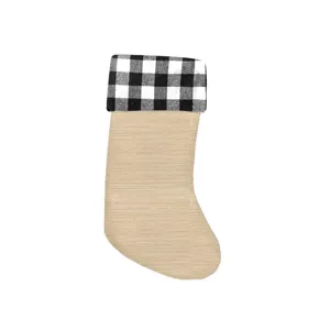 Christmas stocking detail showing the imitation burlap body and black-and-white plaid cuff.