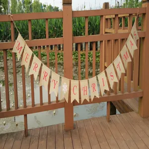 Rustic burlap Christmas banner hanging on outdoor wooden railing, perfect for holiday decor.