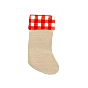 Detailed view of the Christmas burlap stocking with red white buffalo plaid cuff holiday decor.