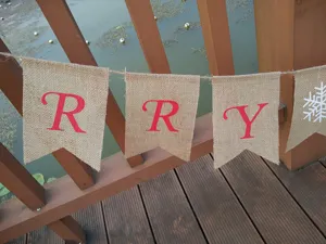 Rustic burlap Christmas banner with red letters and snowflake pattern, ideal for holiday party decor.