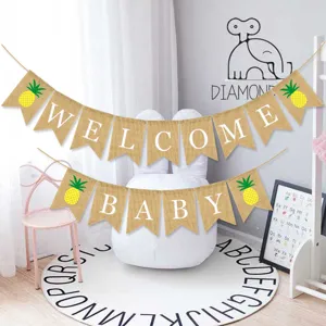 Close-up detail of the burlap WELCOME BABY banner with cute pineapple prints for baby party.