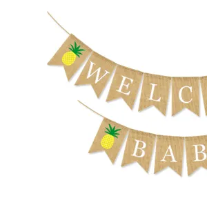 Burlap banner with pineapple and WELCOME BABY letters for baby birthday party decoration detail.