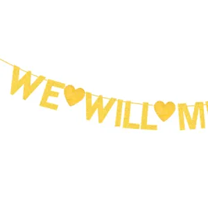 Gold glitter banner detail showing letters and heart shapes for party decoration use.