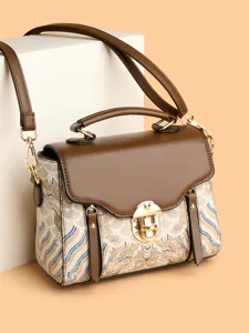 Vintage retro style women shoulder handbag with wave pattern print and gold lock hardware.