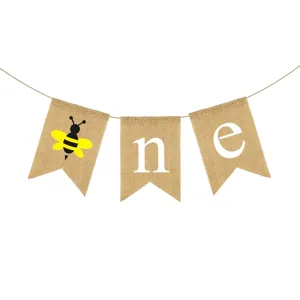 Burlap ONE banner detail featuring cute bee and letter print, perfect for first birthday party.